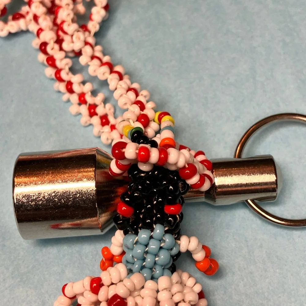 Native American, glass beaded doll pendant.